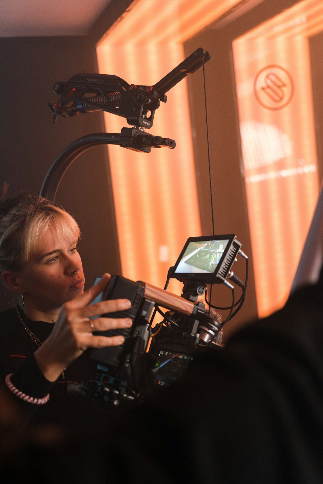 Female audiovisual training instructor smiling in a studio