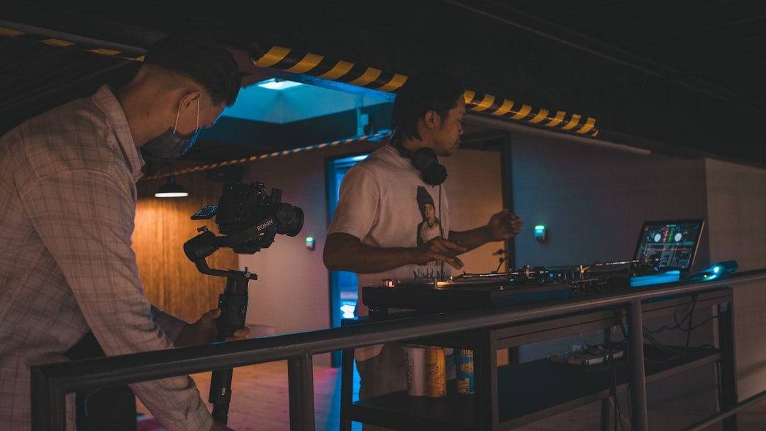 Multi-camera live broadcast control room with technicians monitoring video feeds